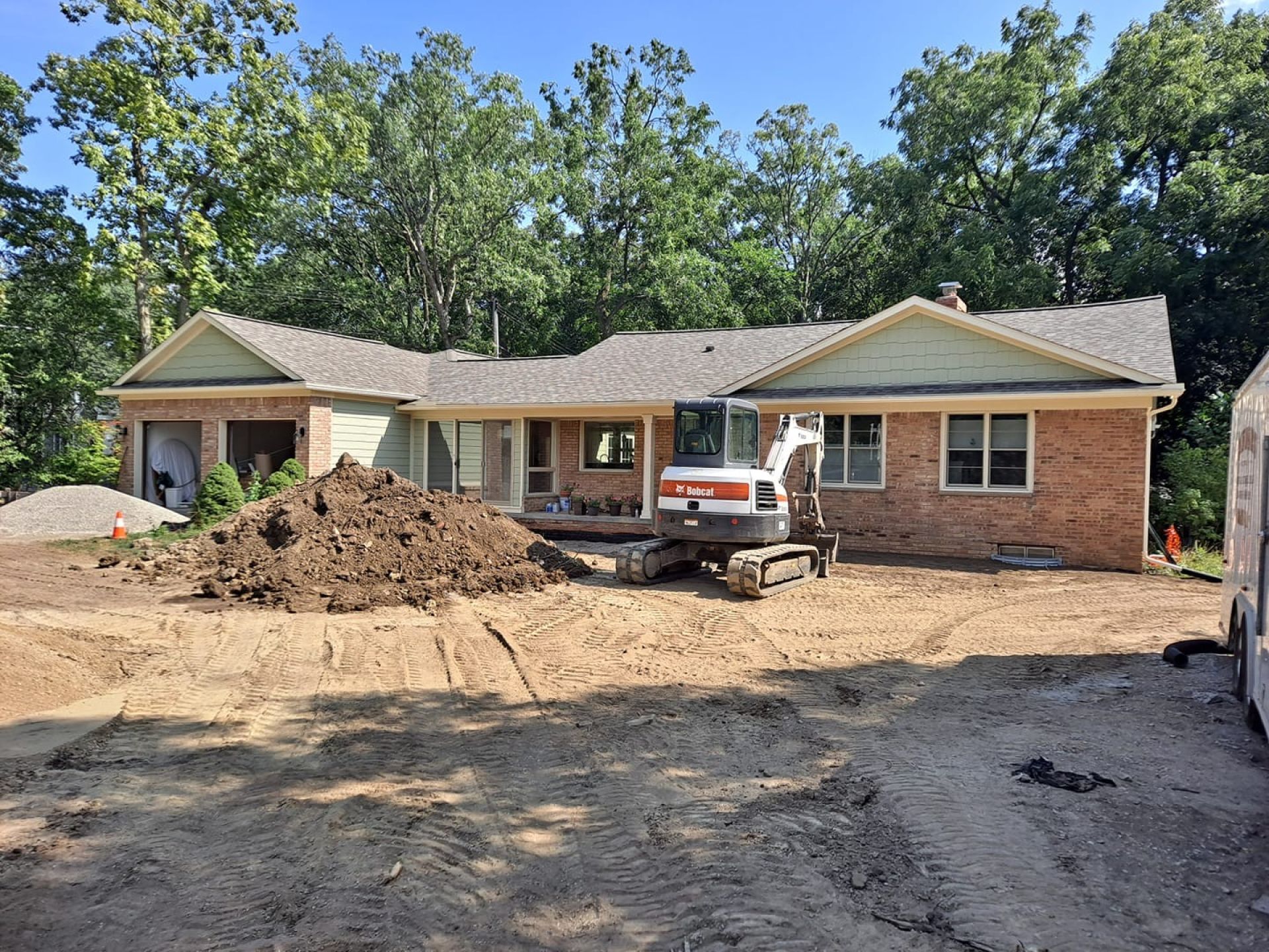 Grading the front yard to water flows away from the house and will not get into the basement
