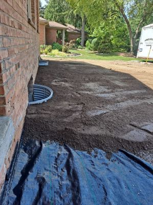 Grading to get water to flow away from the house.